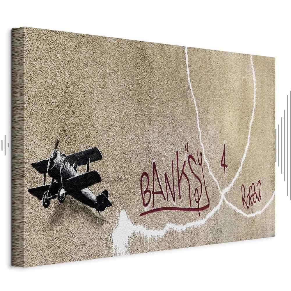 Leinwandbild - Banksy's Plane (1-part) - Red Graffiti Text on Mural Background