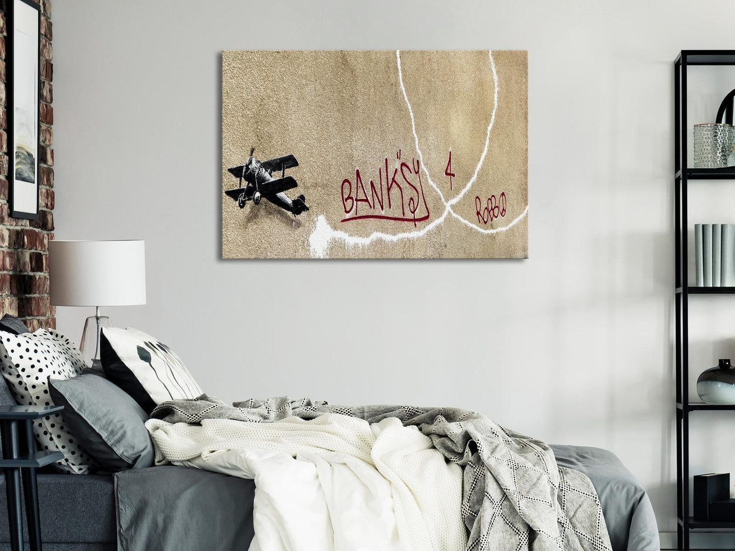Leinwandbild - Banksy's Plane (1-part) - Red Graffiti Text on Mural Background Artgeist