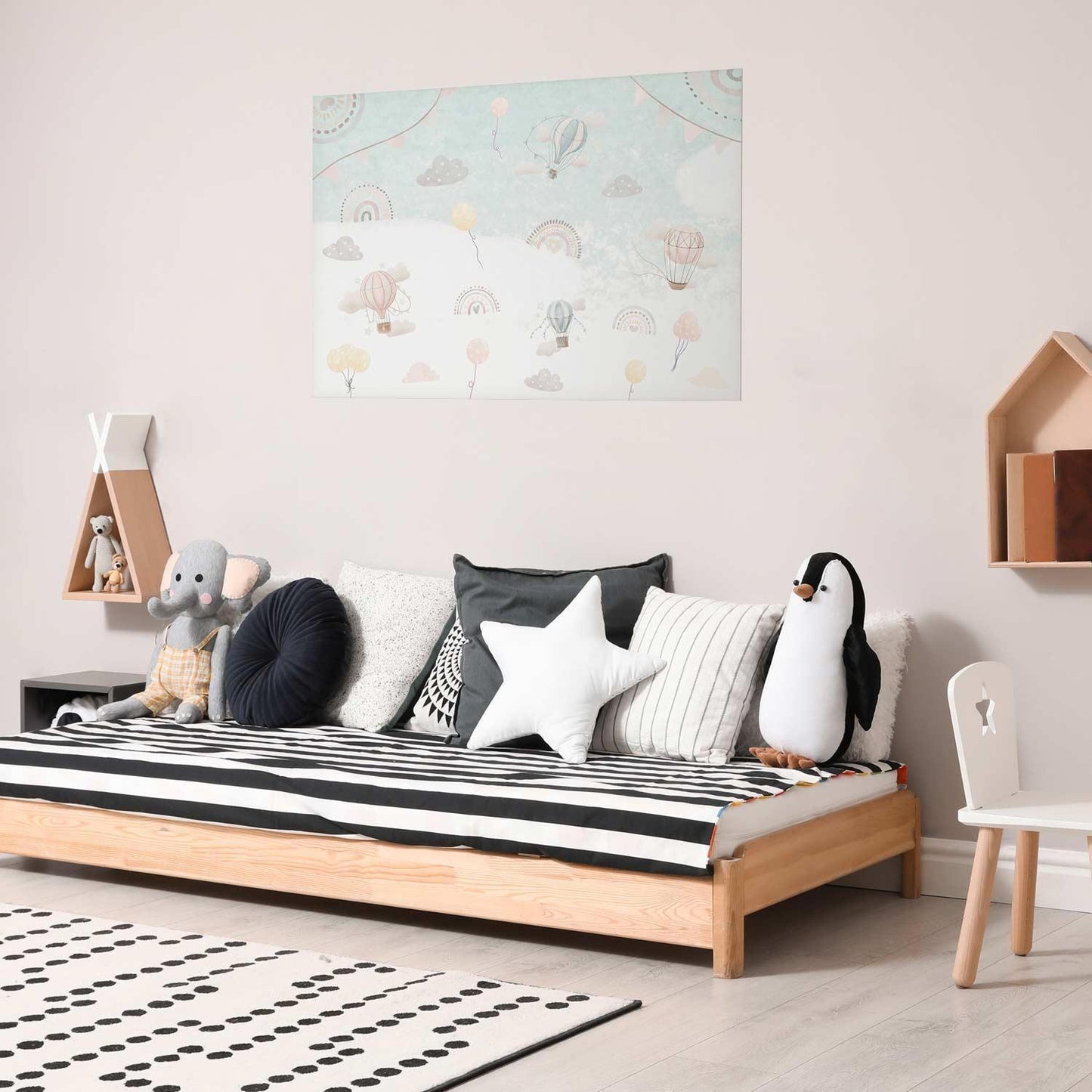 Poster "Adventure Among the Clouds" in children's room décor.
