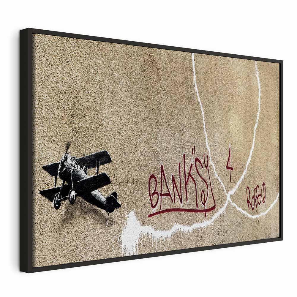 Leinwandbild - Banksy's Plane (1-part) - Red Graffiti Text on Mural Background