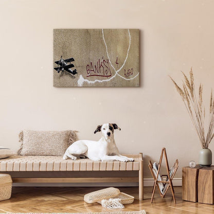 Leinwandbild - Banksy's Plane (1-part) - Red Graffiti Text on Mural Background