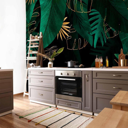 Fototapete - Jungle and composition - motif of green and golden leaves on a black background