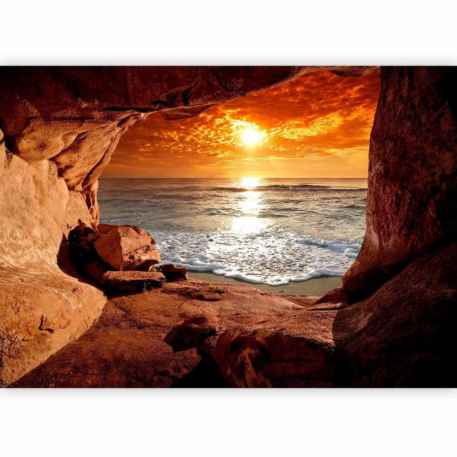 Fototapete „Höhlenausgang mit Blick aufs Meer“ – Sonnenuntergang & Naturkulisse für traumhafte Räume
