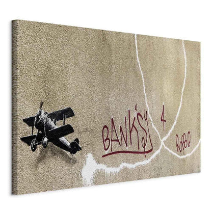 Leinwandbild - Banksy's Plane (1-part) - Red Graffiti Text on Mural Background