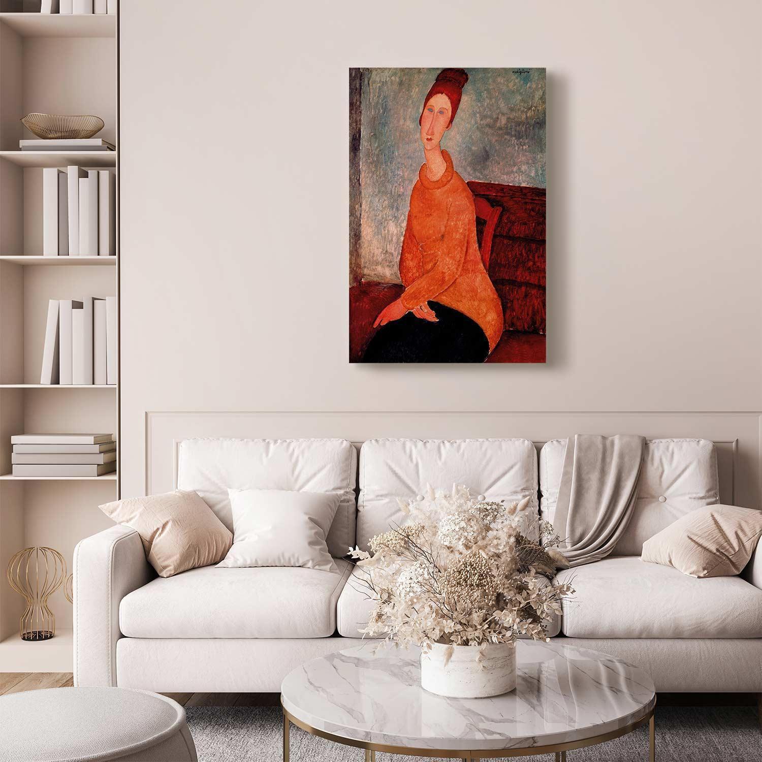 Canvas art of Jeanne Hebuterne in a yellow sweater hanging in a stylish living room.