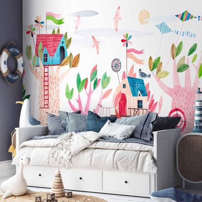 Fototapete - Painted tree houses - a colourful fantasy with kites for children