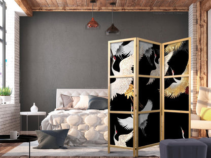 Japanischer Paravent - Cranes at Night - White and Gold Birds Flying Away on a Black Background Artgeist