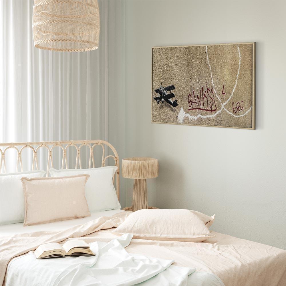 Leinwandbild - Banksy's Plane (1-part) - Red Graffiti Text on Mural Background