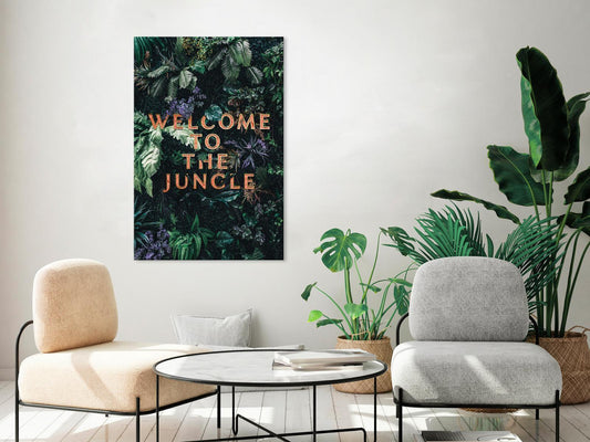 Canvas wall art with "Welcome to the Jungle" text, featuring lush green foliage, ideal for stylish home decor.