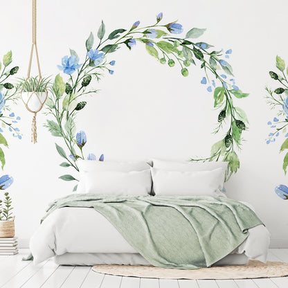 Fototapete - Romantic wreath - plant motif with blue flowers and leaves Artgeist