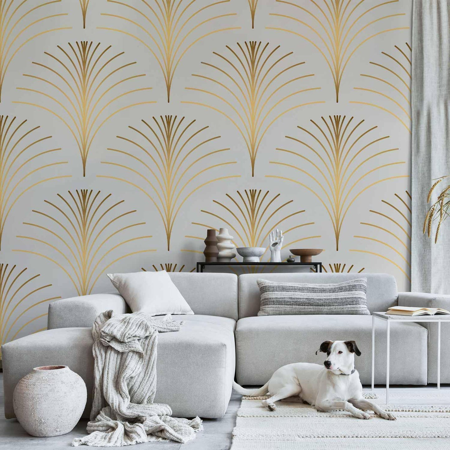 Gold linear pattern wallpaper on marble background in modern living room setting with sofa and decorative elements.