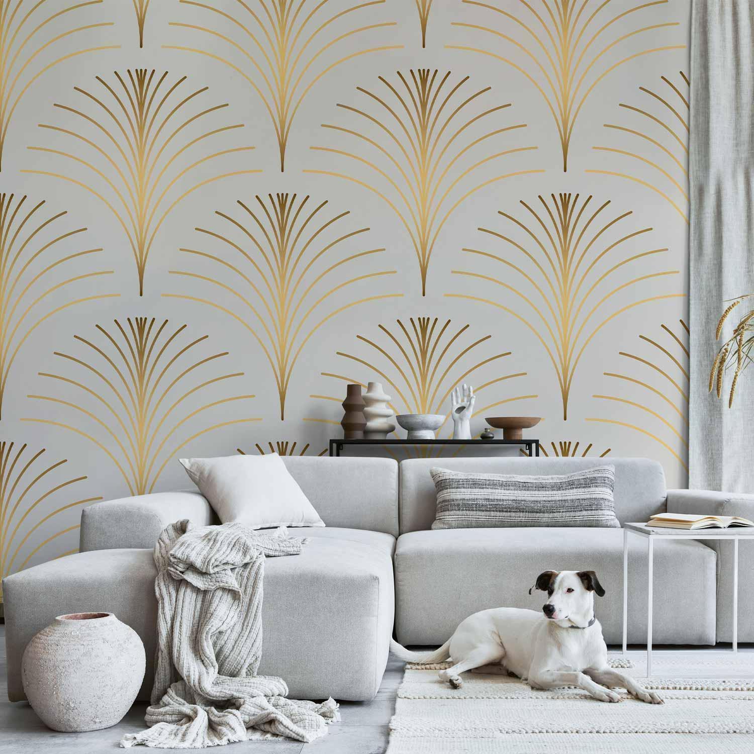 Gold linear pattern wallpaper on marble background in modern living room setting with sofa and decorative elements.