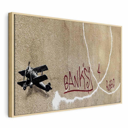 Leinwandbild - Banksy's Plane (1-part) - Red Graffiti Text on Mural Background