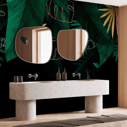 Fototapete - Jungle and composition - motif of green and golden leaves on a black background