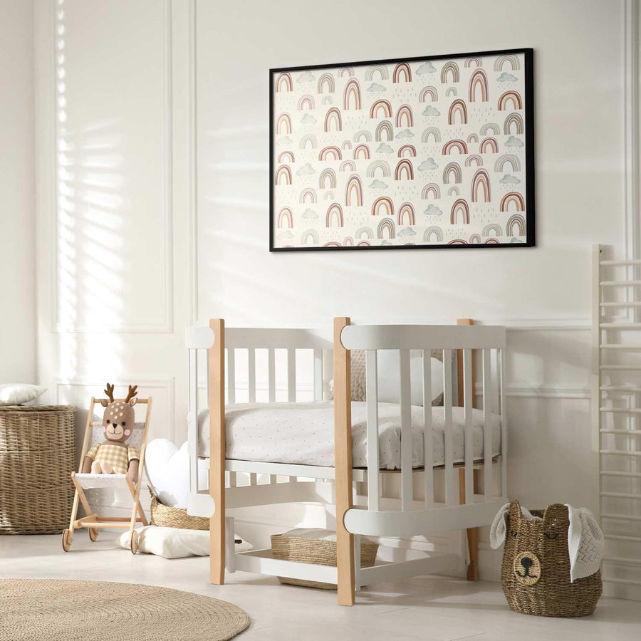 Nursery room with a framed rainbow-themed poster on the wall.