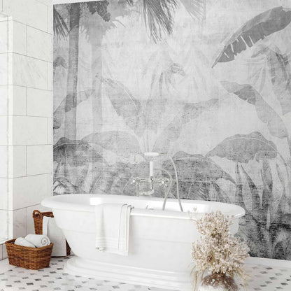 Fototapete - Vanishing jungle - landscape of exotic trees and leaves in grey tones