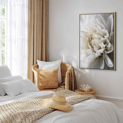 Canvas wall art featuring a white dahlia in a serene bedroom setting.