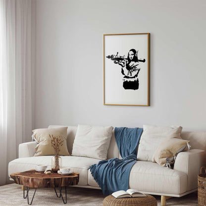 Banksy-style Mona Lisa with rocket launcher poster in modern living room.