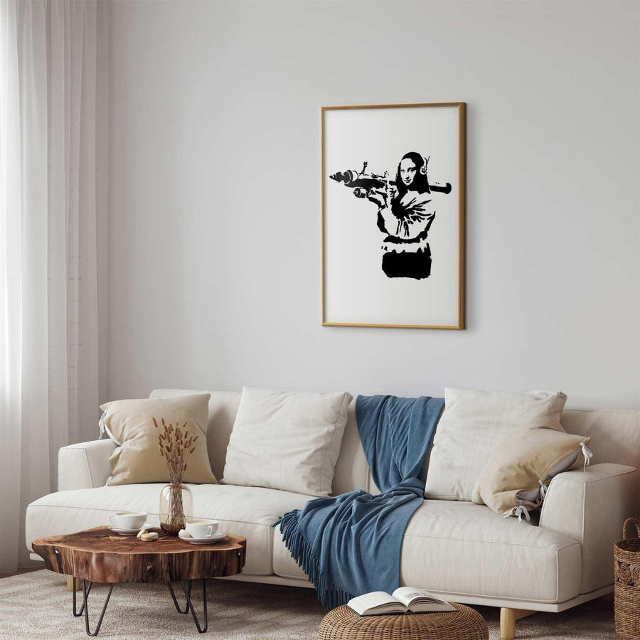 Banksy-style Mona Lisa with rocket launcher poster in modern living room.