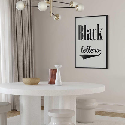 Poster with "Black Letters" design hanging in a modern interior.