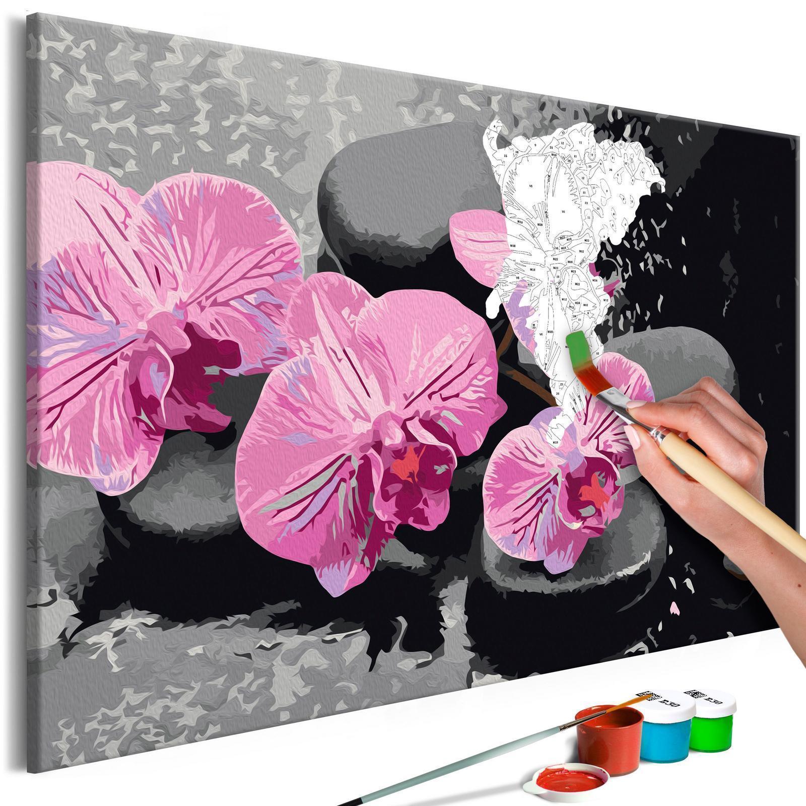 Wandbild zum Ausmalen Orchid With Zen Stones Dekoration - elegante Orchidee mit Zen-Steinen auf schwarzem Hintergrund als Wandschmuck