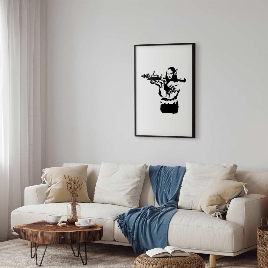 Banksy Mona Lisa poster with rocket launcher in modern living room décor.