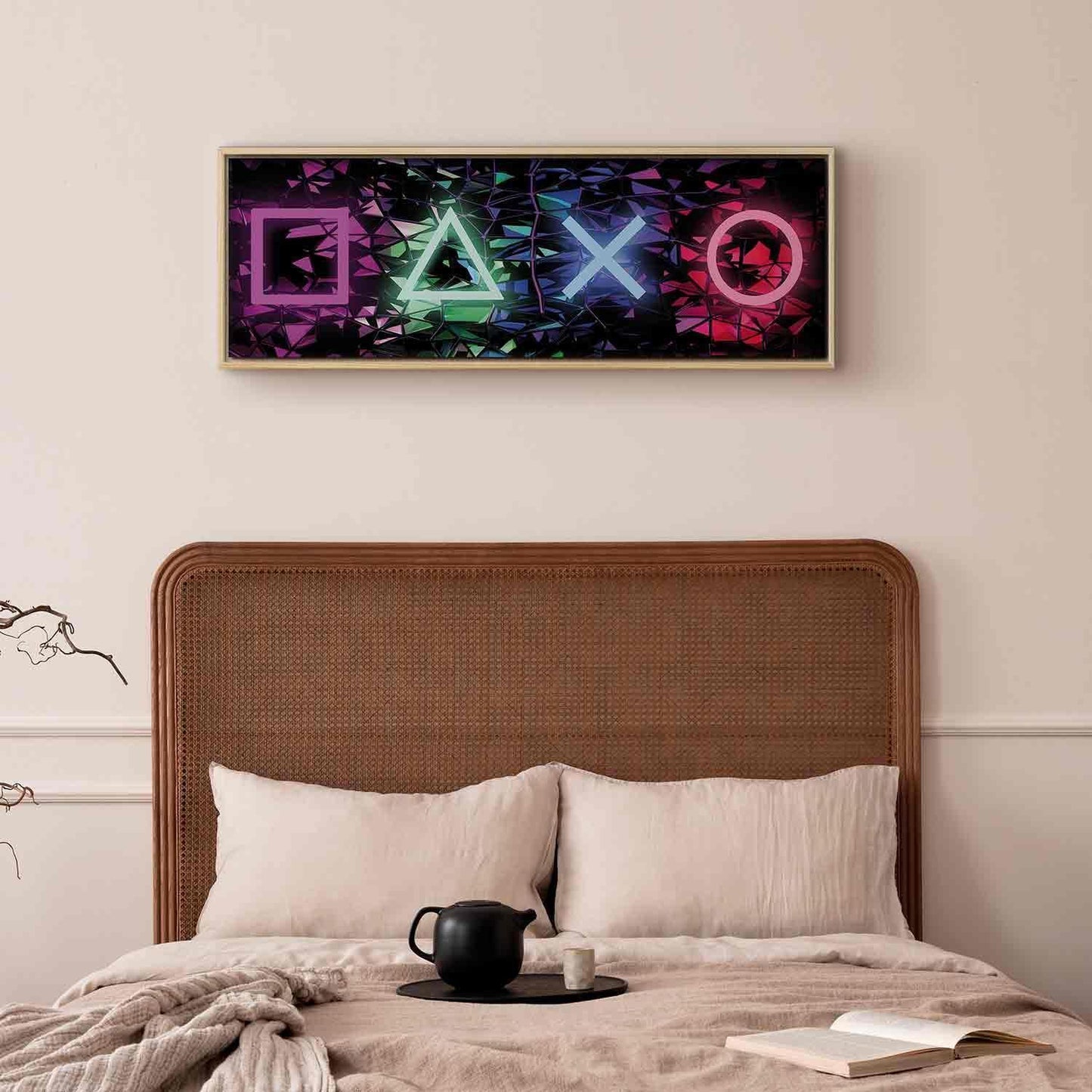 Canvas wall art with fun symbols in a colorful geometric design above a bed.