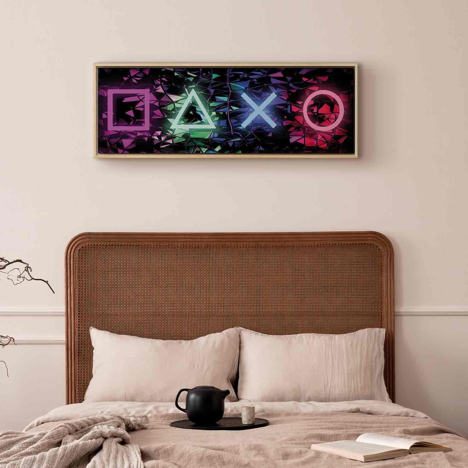 Canvas wall art with fun symbols in a colorful geometric design above a bed.