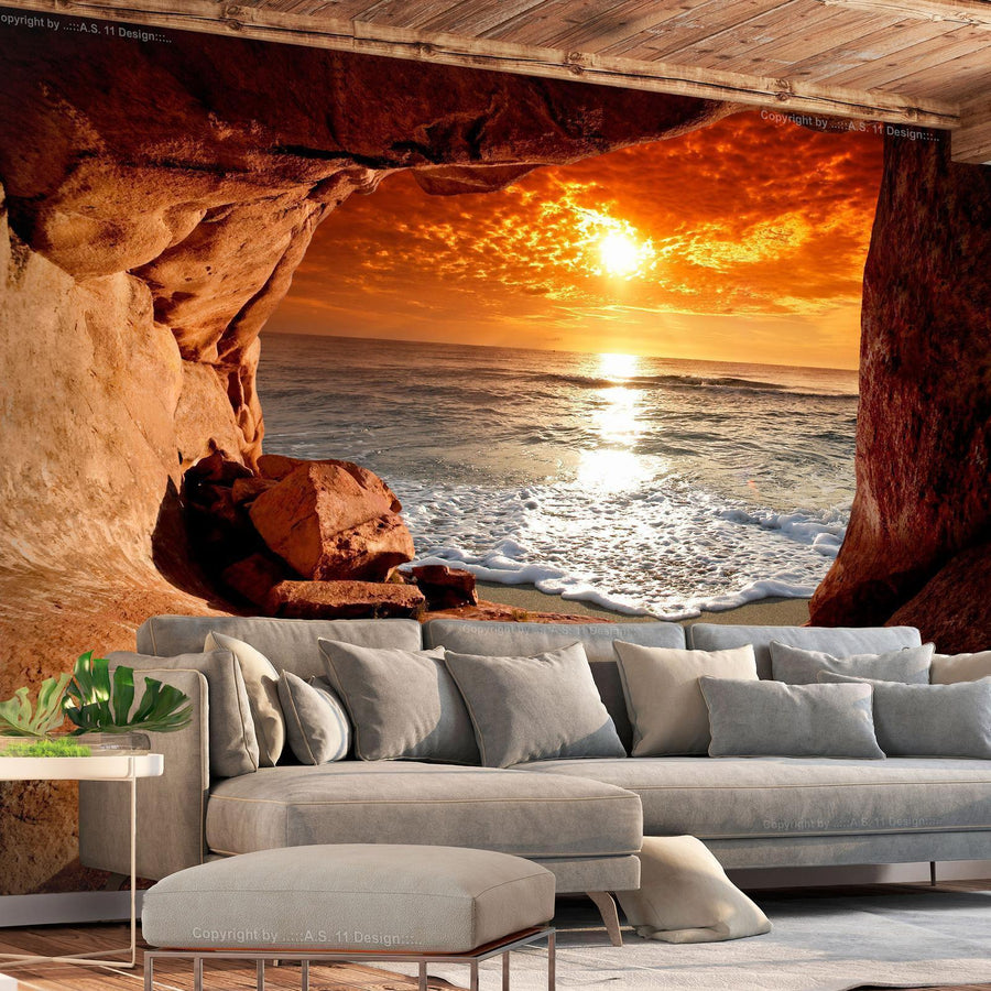 Fototapete „Höhlenausgang mit Blick aufs Meer“ – Sonnenuntergang & Naturkulisse für traumhafte Räume