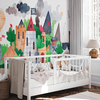 Fototapete - A colourful treasure island with a castle - a pirate ship at sea for children