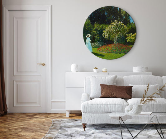 Round wall art of Claude Monet's "Woman in the Garden" painting, showcasing vibrant spring vegetation.