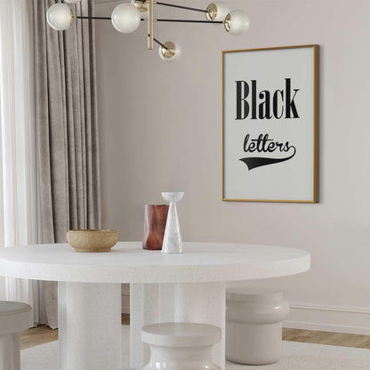 Poster - Black Letters in a modern interior with minimalist decor and gold frame.