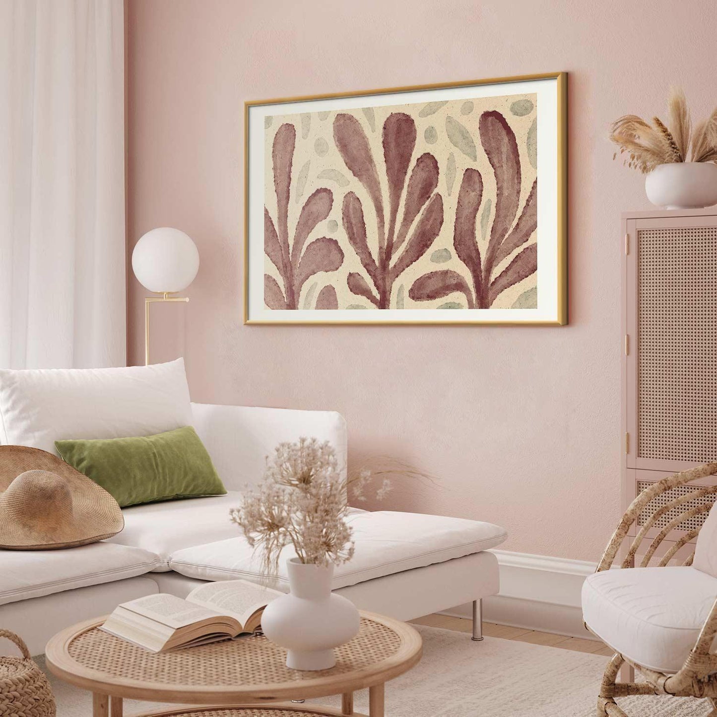 Poster featuring large trembling leaf shapes with spots, inspired by Matisse, in a modern living room setting.