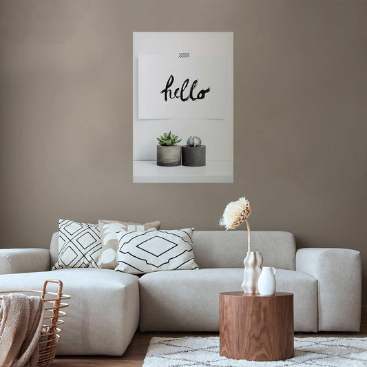 Scandinavian Home Poster on wall above modern sofa with neutral decor.