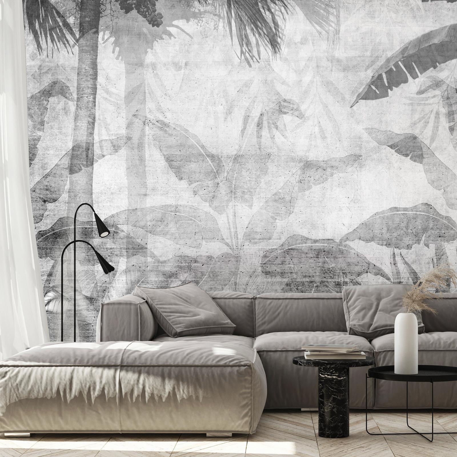 Fototapete - Vanishing jungle - landscape of exotic trees and leaves in grey tones Artgeist