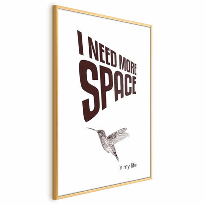 Poster titled "I Need More Space" featuring a hummingbird graphic in a gold frame.