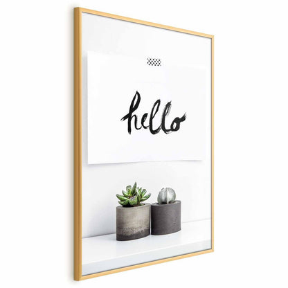 Scandinavian home poster with "hello" text in a gold frame.