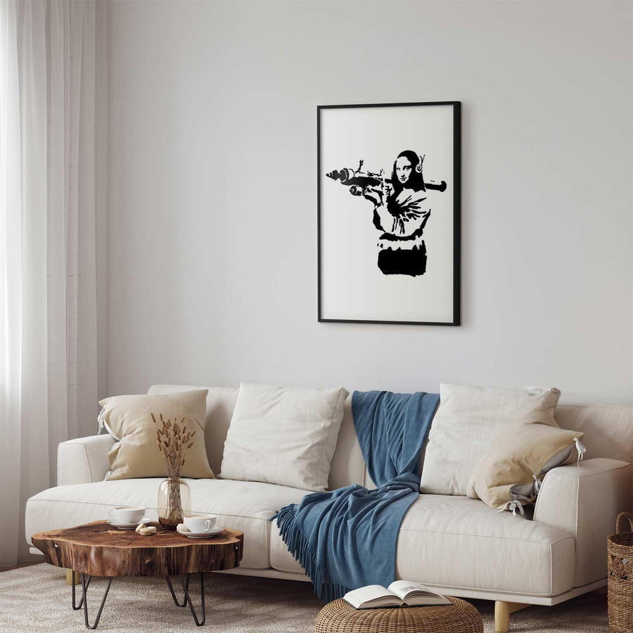 Poster of Banksy's Mona Lisa with rocket launcher on modern living room wall.