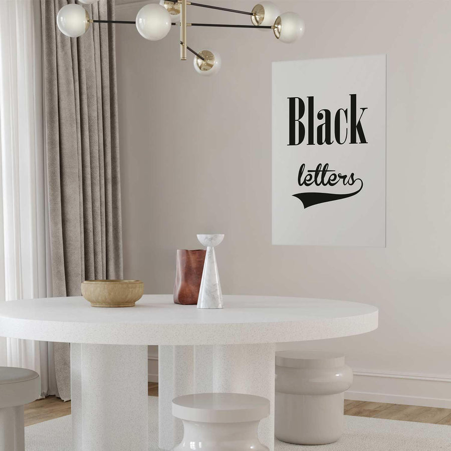 Poster displaying black letters in a modern interior design setting.