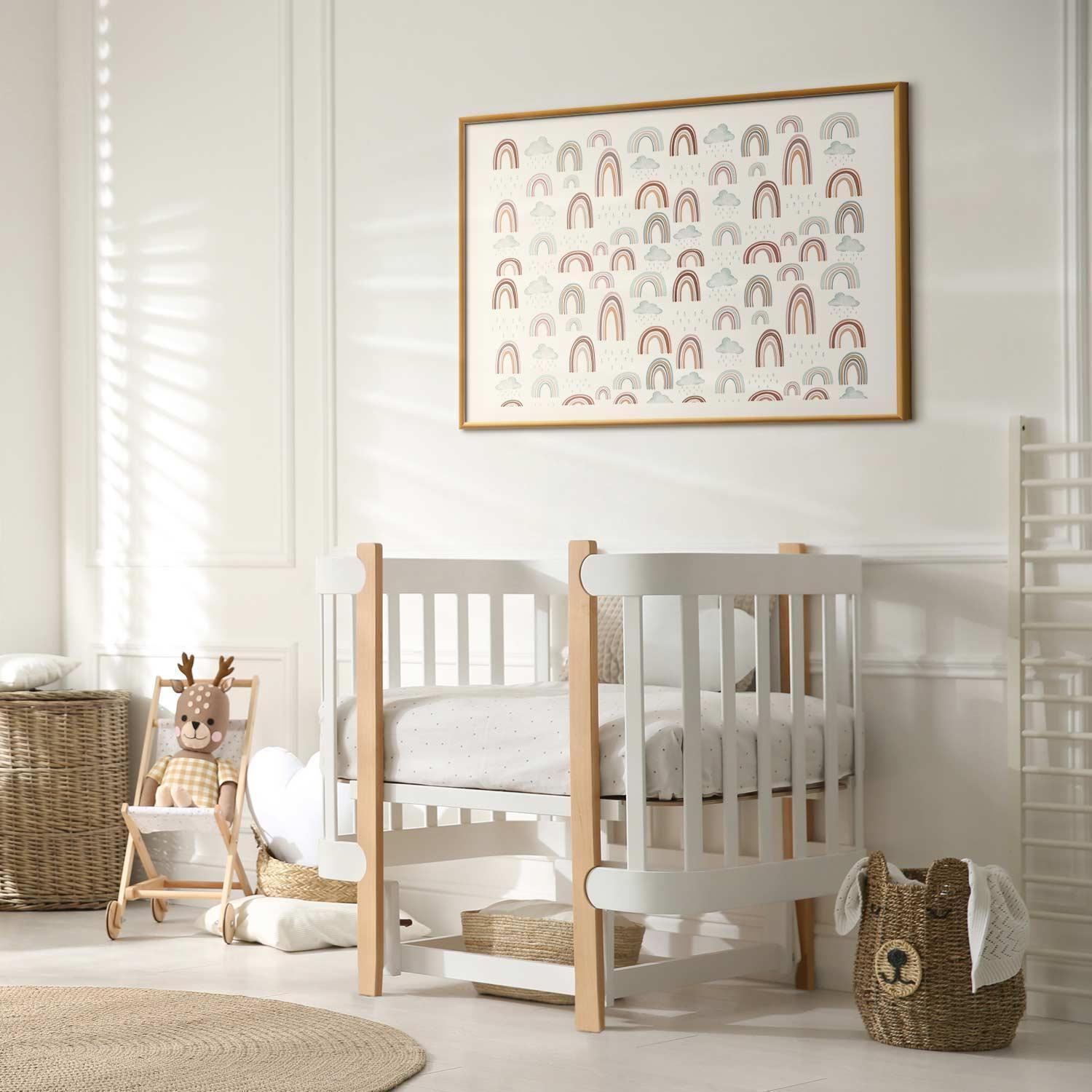 nursery room with framed rainbow poster on wall