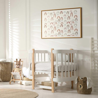 nursery room with framed rainbow poster on wall